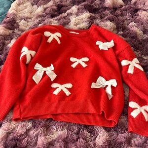 Elegant Red Sweater with White Bow Accents